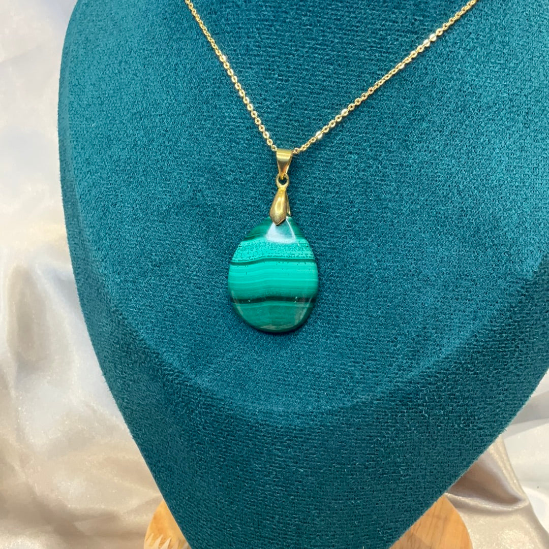 Malachite pendant with gold plated chain and clasp.