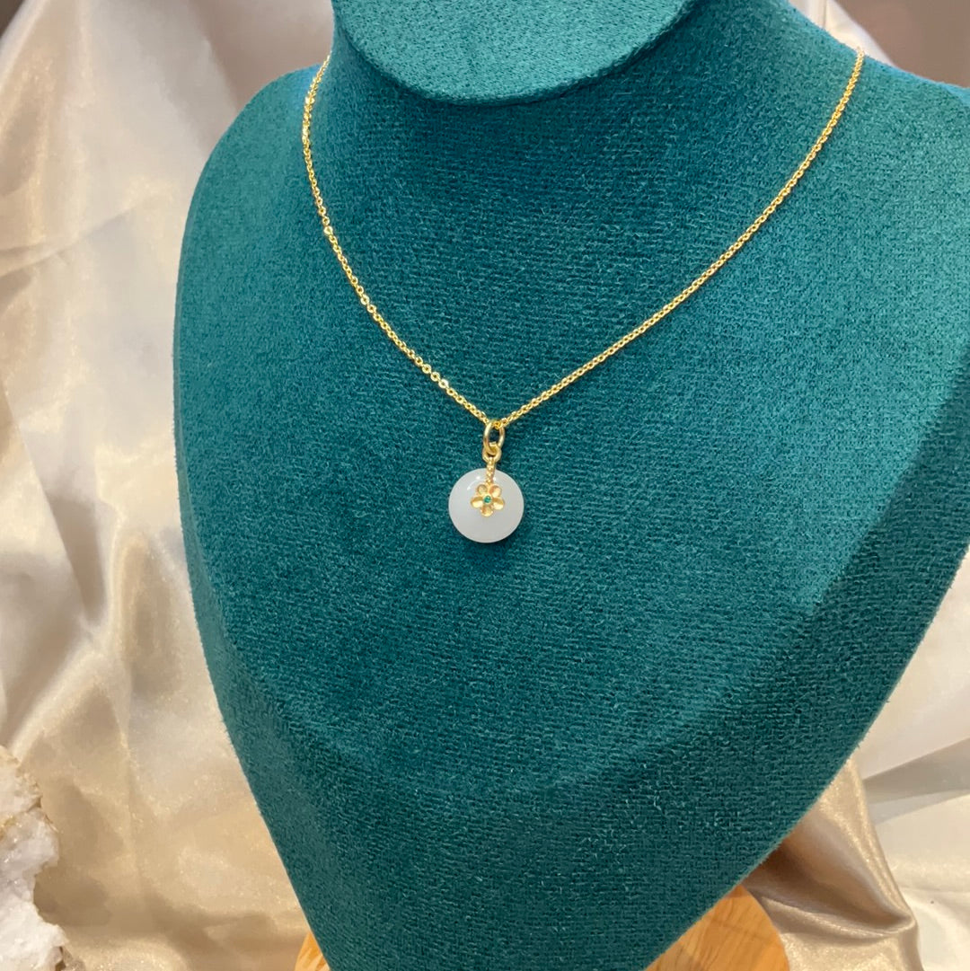 White round pendant on gold plated chain