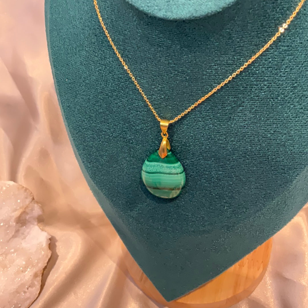 Malachite pendant with gold plated chain and clasp.