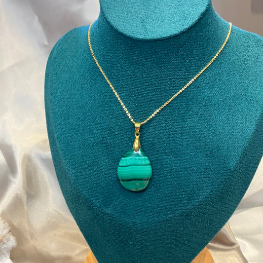 Malachite pendant with gold plated chain and clasp.