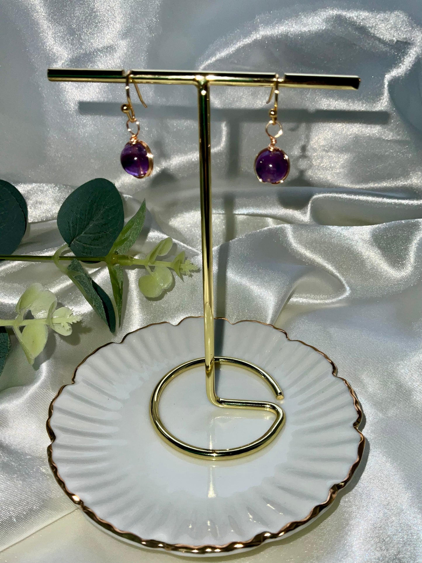 Amethyst sphere earrings wrapped in gold plating. Earring hooks are 925 sterling silver plated.