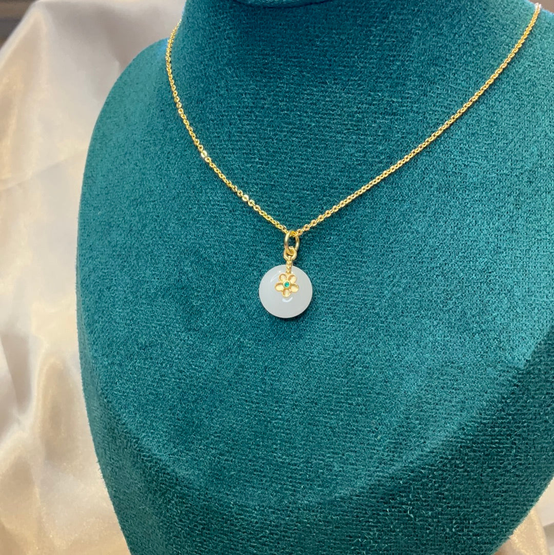 White round pendant on gold plated chain