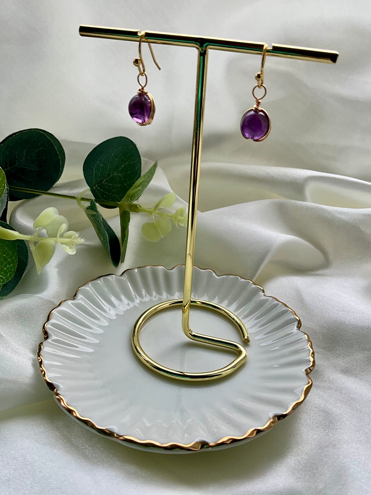 Amethyst sphere earrings wrapped in gold plating. Earring hooks are 925 sterling silver plated.