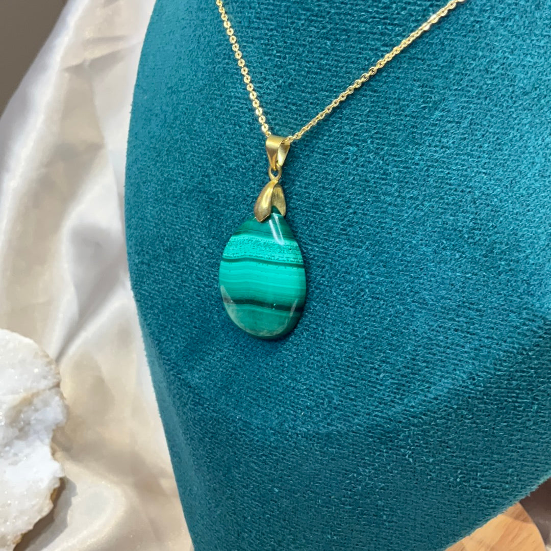 Malachite pendant with gold plated chain and clasp.