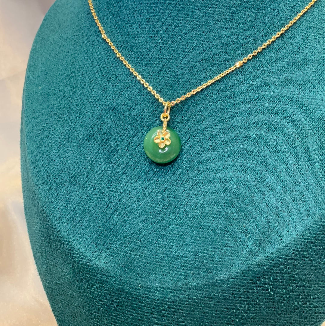 Jade pendant on gold plated chain