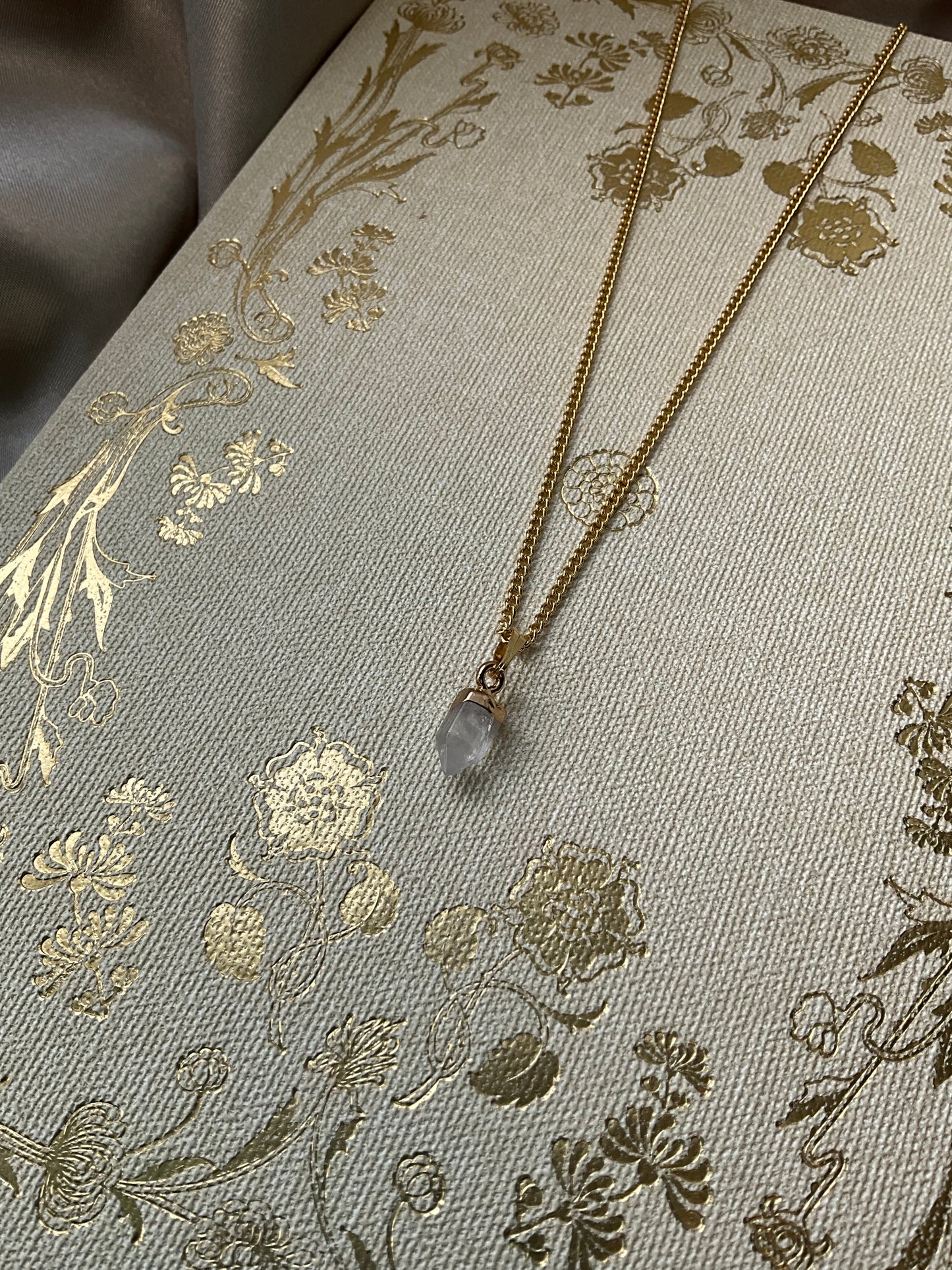 Clear Quartz Point on Gold Stainless Steel Chain