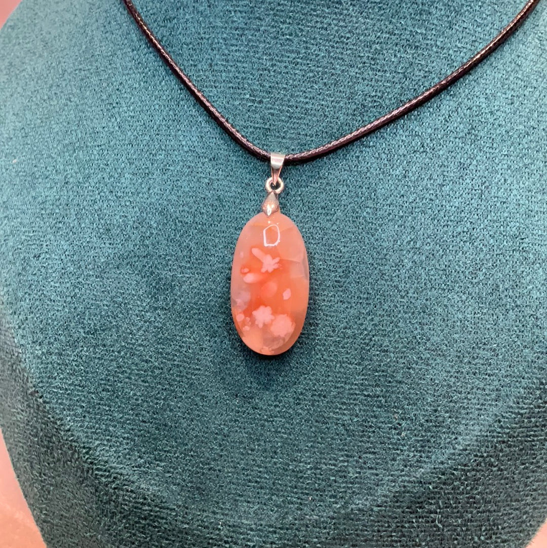 Carnelian flower agate crystal oval pendant on black cord