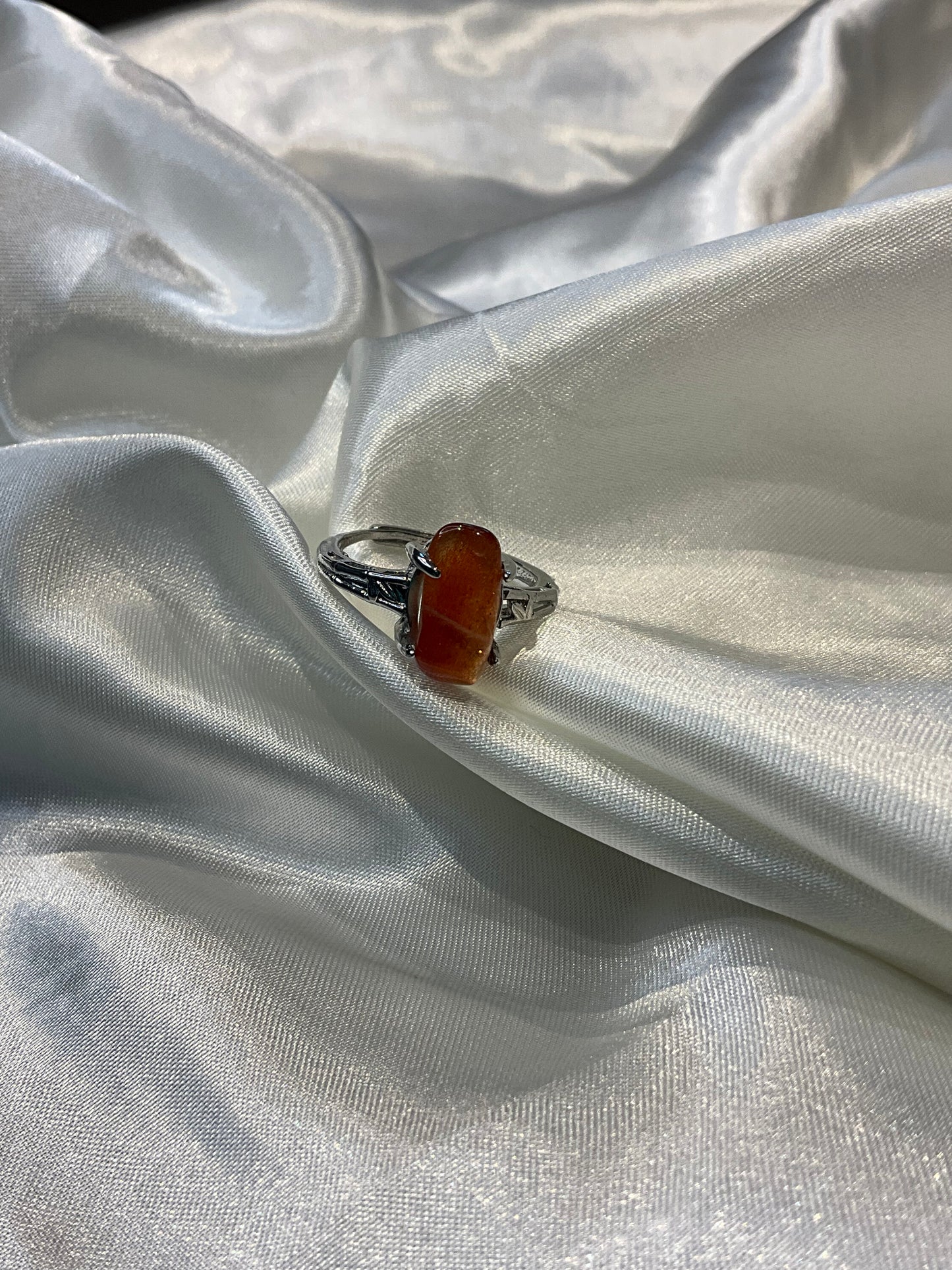 Sunstone chip in claw adjustable silver plated ring