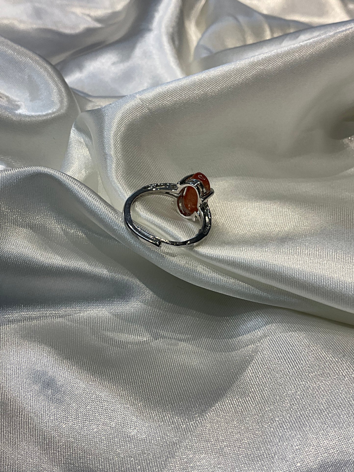 Sunstone chip in claw adjustable silver plated ring