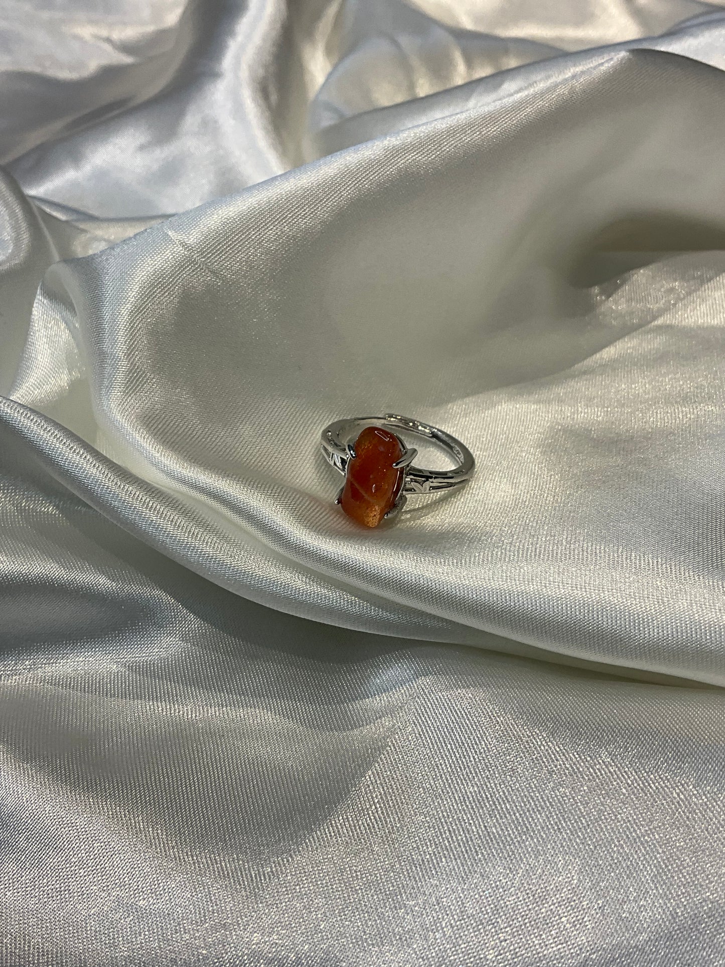 Sunstone chip in claw adjustable silver plated ring