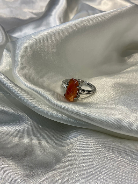 Sunstone chip in claw adjustable silver plated ring